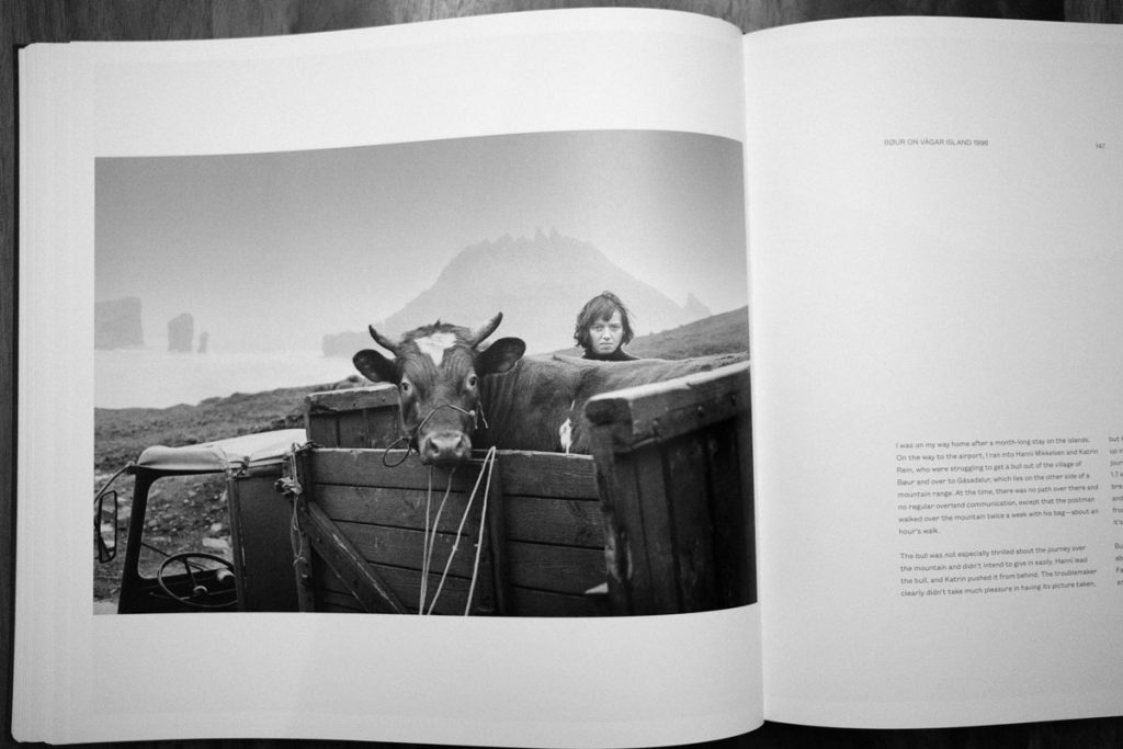 Photo of a woman and a cow in the Faroe Islands, from Faces of the North